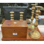 Two pairs of brass candlesticks and a mahogany box.