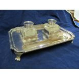 A silver inkstand with two glass bottles silver lids presented in 1951/2.