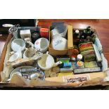 A collection of items from an old chemist’s shop including; feeding cups, glasses, tins, packets and
