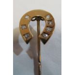 A yellow metal diamond set horseshoe stick pin (i.c.)