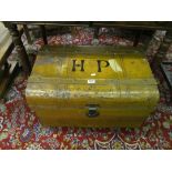 A vintage metal trunk marked H.P.