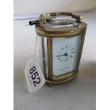 A small carriage clock retailed Charles Frodsham