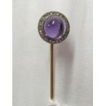 A Victorian stick pin with cabouchon amethyst and diamond terminal