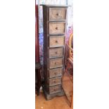 An 8 drawer narrow chest