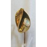 An 18k gold stick pin set opal marked Tiffany & Co. Piretti 1984
