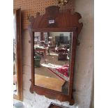 A mahogany mirror.