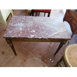 A marble top coffee table with gilt base