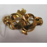 A Victorian yellow metal buckle shaped and scroll brooch