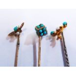 A yellow metal Victorian stick pin with insect terminal set seed pearl and turquoise, another dice