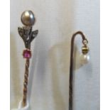 A stick pin set pearl, diamond and ruby and another set seed pearl drop (i.c.)