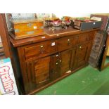A mahogany sideboard three drawers and cupboards
