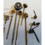 A tigers' eye and seed pearl stick pin, five other Victorian stick pins and four pins