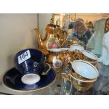 A gilt lustre teaset with scenes of courting couples and Aynsley cup and saucer