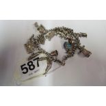 A silver charm bracelet hung and charms