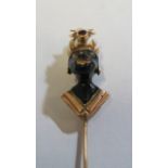 A yellow metal stick pin with Blackamore enamel and ruby (i.c.)