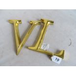 Two Louis Vuitton style gold coloured L and V letters