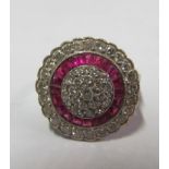 An Art Deco 18ct gold ruby and diamond cluster ring.