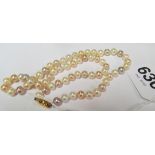 A pearl necklace with 9ct gold clasp