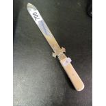 A Victorian silver paperknife the ivory handle with concealed penknives London 1876
