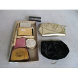 A pink enamel compact, musical compact, two other compacts, two evening bags, two purses and a