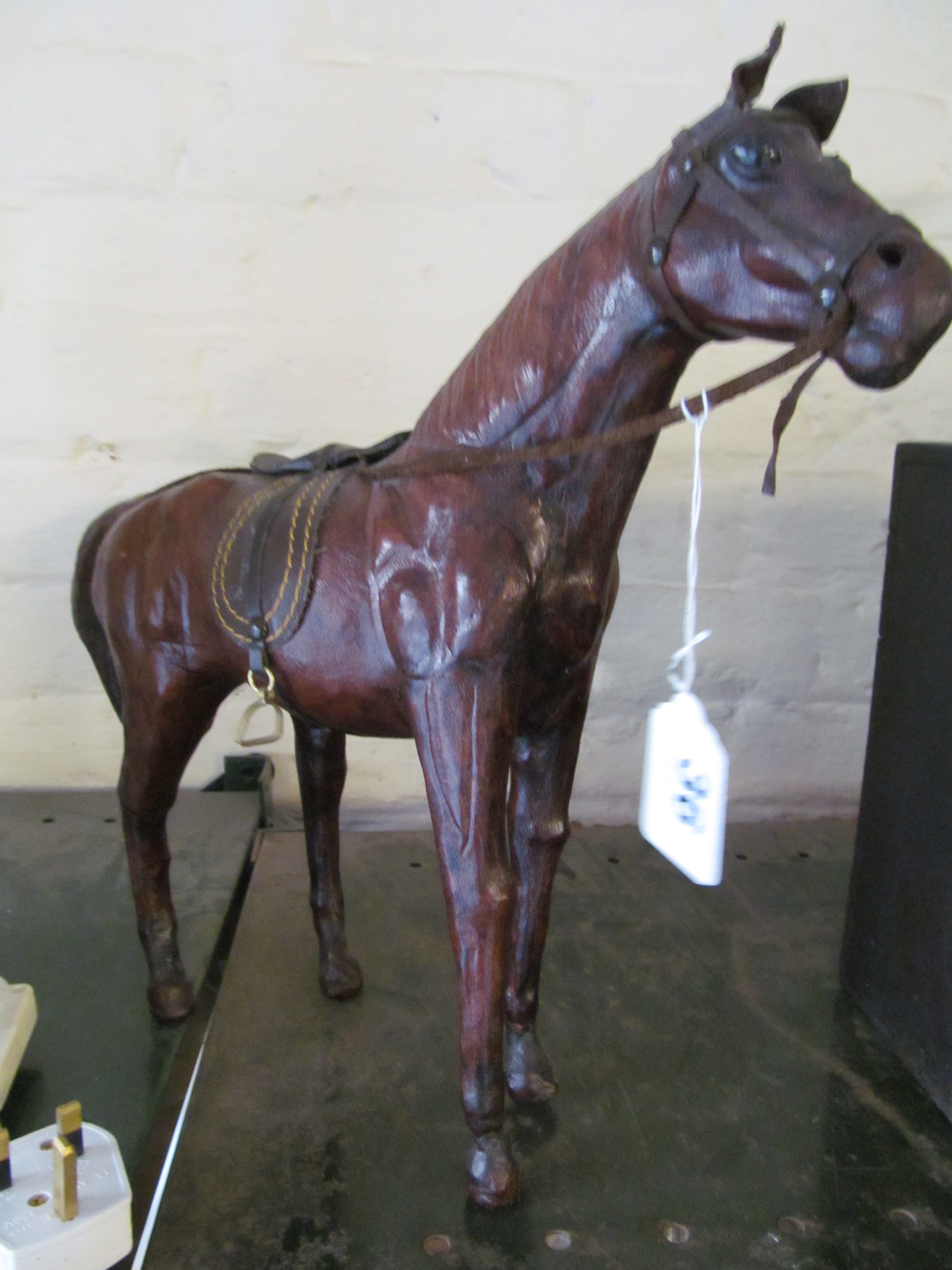 A leather ornament of a horse