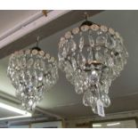 A pair four tier drop lustre chandeliers with pink flowers