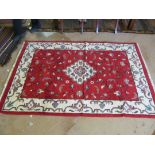 A red and cream modern Persian rug.