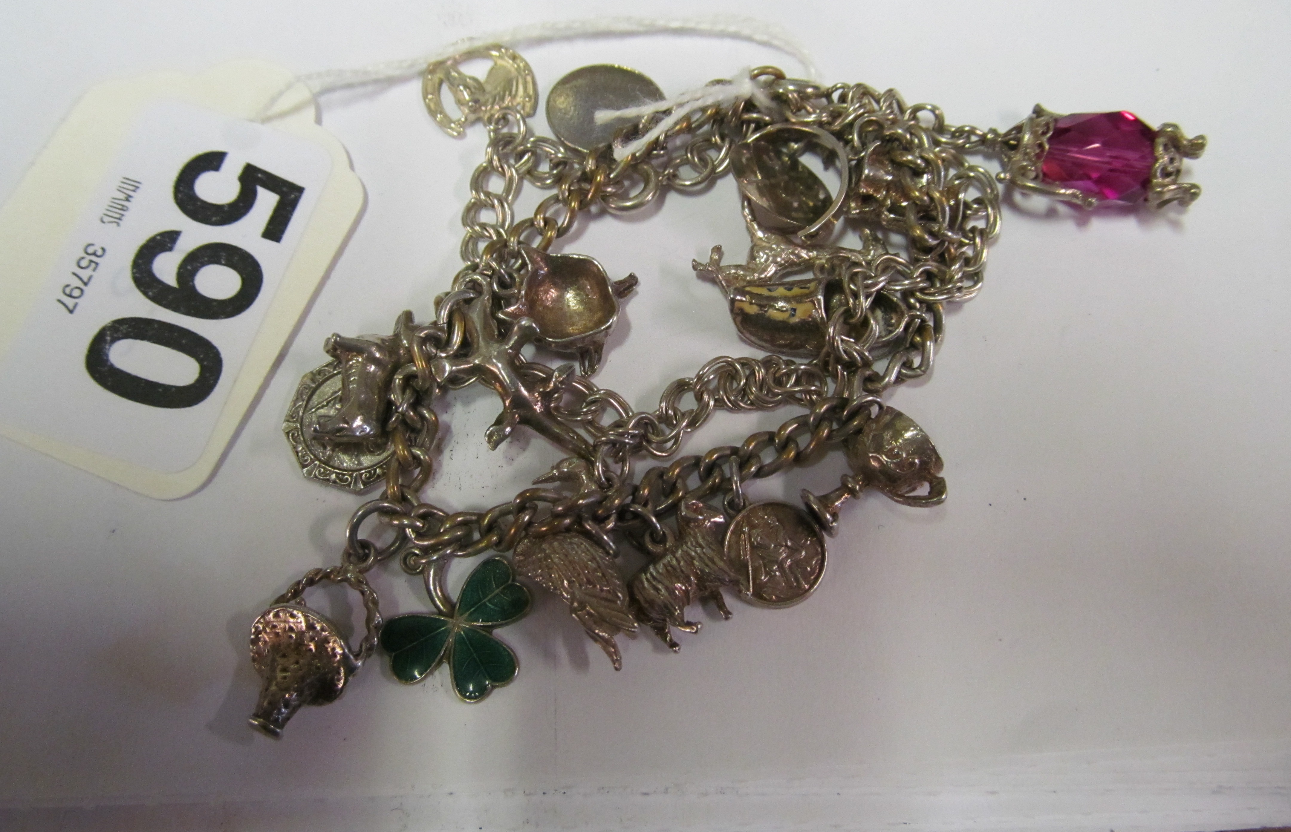 Two silver charm bracelets and charms