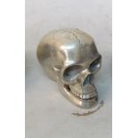 A silver coloured skull.