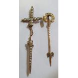 A Victorian stick pin in the form of a sword set seed pearls and horseshoe stick pin set seed pearls