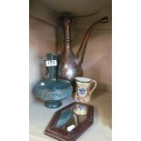 An Eastern copper ewer, modern oriental vase, jug with Brighton crest and a mirror.