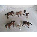 A Beswick reindeer, donkey and four horses.