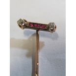 A Victorian stick pin with ruby and diamond bar (i.c.)