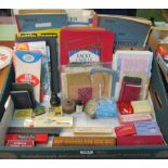 A collection of items from an old Post Office including; books, crib boards, cards, money box,