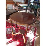 An Edwardian mahogany circular occasional table with undertier