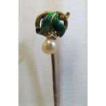 A Victorian stick pin enamel leaves with pearl and diamond chip drop some enamel missing