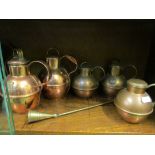 Some copper creamer jugs and brass weights