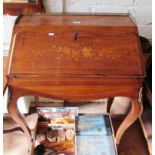 A 19th Century French rosewood bureau de dame inlaid front, fitted interior with well on cabriole