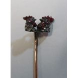 A Victorian stick pin with double headed cockerel set diamonds and red enamel (i.c.)