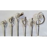 Six Charles Horner silver hat pins swirl patterns on steel stems displayed on card