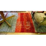 A Moroccan green and red rug.