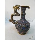 An Oriental Cloisonné jug with dragon handle and five claw detail