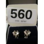 A pair of cubic zirconia single stone earrings