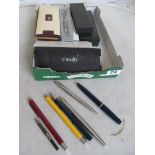 A black Parker pen and various Cross pens (all boxed) and other pens (unboxed)