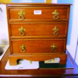 A small mahogany chest of three drawers