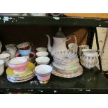 A part crinoline lady teaset (one cup and saucer deficient), a part harlequin teaset and various