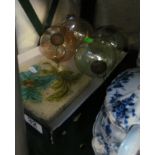 Four decorative glass balls and pair of tiles