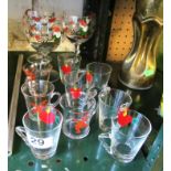 Three wine glasses with Christmas decoration and nine liqueur glasses