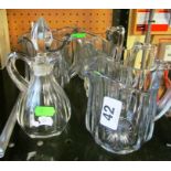 A set of five glass water jugs and vinegar jug