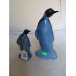 A large Poole pottery penguin and another smaller